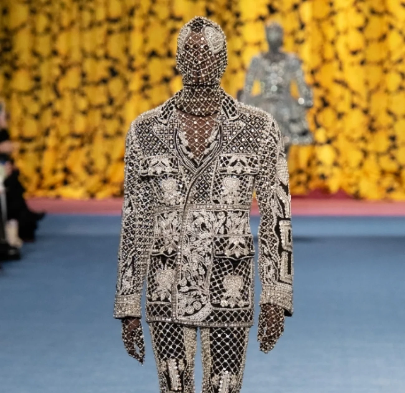 Richard Quinn is celebrated for his bold, vibrant prints and dramatic, couture-like designs. His collections often feature striking patterns, voluminous silhouettes, and a fearless approach to color and texture.