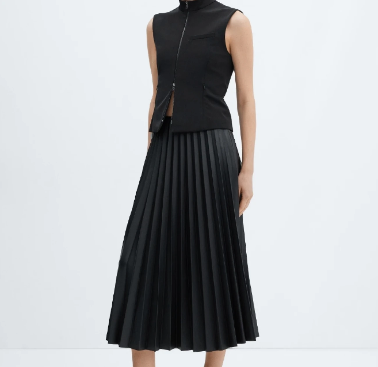 Black leather finish pleated skirt from the fashion label Mango is currently running a 50% off sale, and this skirt is one of our top wardrobe staples
