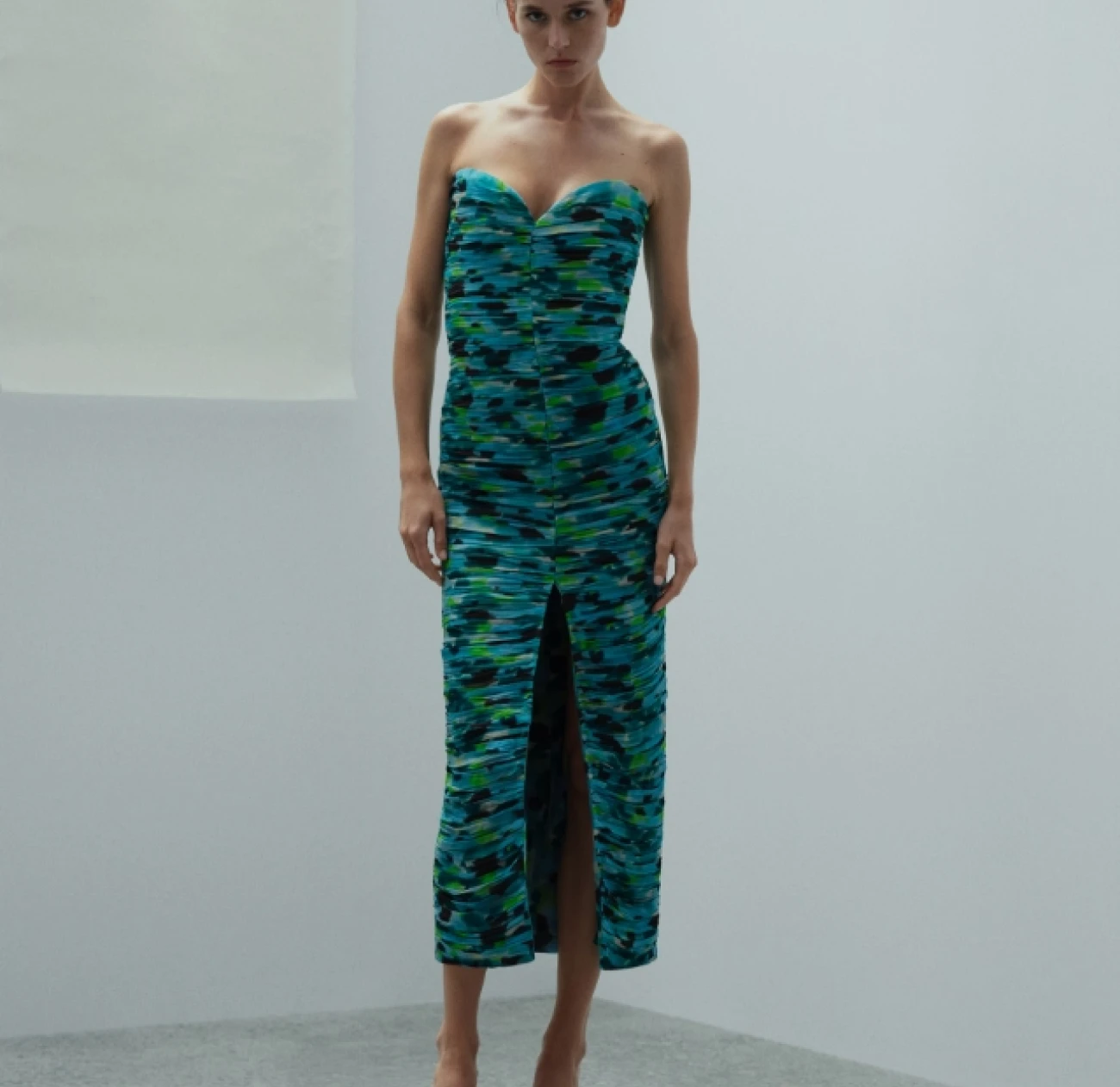 green and blue Mango dress currently on 50% off with a heart bust design and piping through the middle and a high slit, perfect for a summer evening out is on sale at 50% off from Mango - mens and womens fashion store and Goldfoil magazine - your go to source for fashion and lifestyle inspiration in London