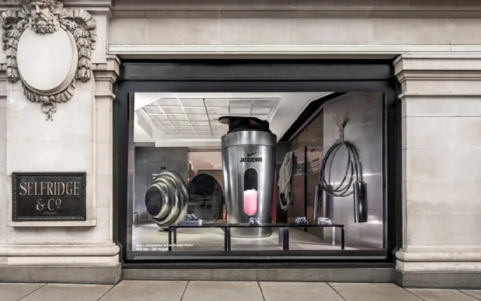 Nike and Jacquemus have launched their latest collaboration with an interactive pop-up at Selfridges' Wonder Room in London. The centerpiece, a revamped Air Max 1, is showcased in a space inspired by gym locker rooms, featuring enlarged Swoosh sculptures and a blend of white and red tones. The installation includes oversized workout equipment and exclusive Nike x Jacquemus pressed juices, merging fashion with functionality. Celebrating the 2024 Paris Olympics, the window display mimics a gym locker, reflecting the playful yet sophisticated spirit of the collection. Simon Porte Jacquemus draws inspiration from both Nike's athletic legacy and his own vintage collection, creating a luxurious tribute to the world of sport. Nike and Jacquemus have launched their latest collaboration with an interactive pop-up at Selfridges' Wonder Room in London. The centerpiece, a revamped Air Max 1, is showcased in a space inspired by gym locker rooms, featuring enlarged Swoosh sculptures and a blend of white and red tones. The installation includes oversized workout equipment and exclusive Nike x Jacquemus pressed juices, merging fashion with functionality. Celebrating the 2024 Paris Olympics, the window display mimics a gym locker, reflecting the playful yet sophisticated spirit of the collection. Simon Porte Jacquemus draws inspiration from both Nike's athletic legacy and his own vintage collection, creating a luxurious tribute to the world of sport.