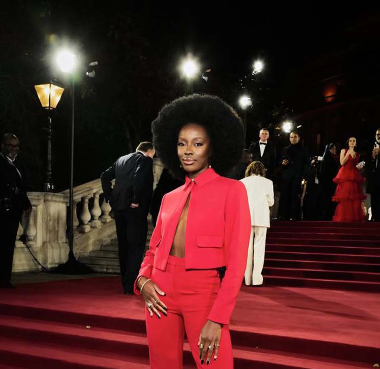 AJ Odudu wears a full hot pink look to the fashion awards 2024