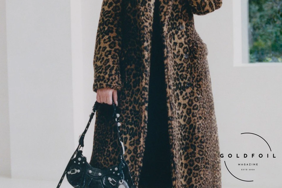 Kim Kardashian in an exclusive fashion editorial for Balenciaga shot in her house in LA, pitctured wearing a long panther print coat Kim Kardashian in an exclusive fashion editorial for Balenciaga shot in her house in LA, pitctured wearing a long panther print coat