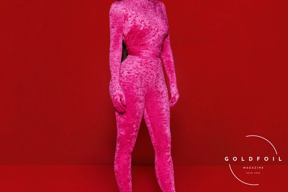 Kim Kardashian wearing a full hot pink look from Balenciaga for Saturday Night Live Kim Kardashian wearing a full hot pink look from Balenciaga for Saturday Night Live