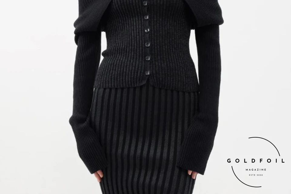 full black outfit from roege hove, with an off the shoulder knitted top and a black slit mini skirt full black outfit from roege hove, with an off the shoulder knitted top and a black slit mini skirt