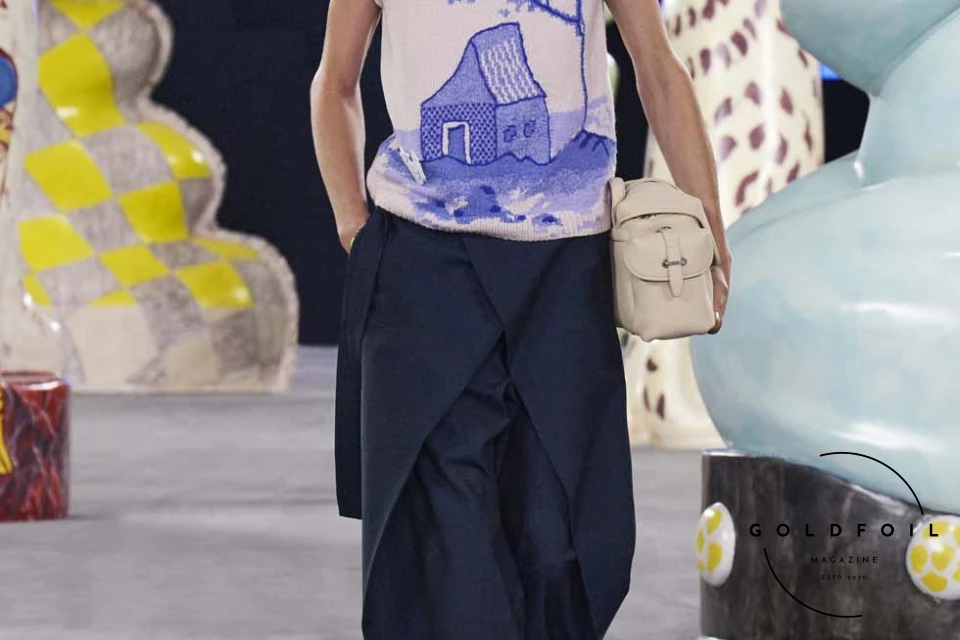 Runway show of Dior Summer 2025 Collection featuring sculptural silhouettes inspired by ceramic forms and atelier craftsmanship, designed by Kim Jones. Runway show of Dior Summer 2025 Collection featuring sculptural silhouettes inspired by ceramic forms and atelier craftsmanship, designed by Kim Jones.