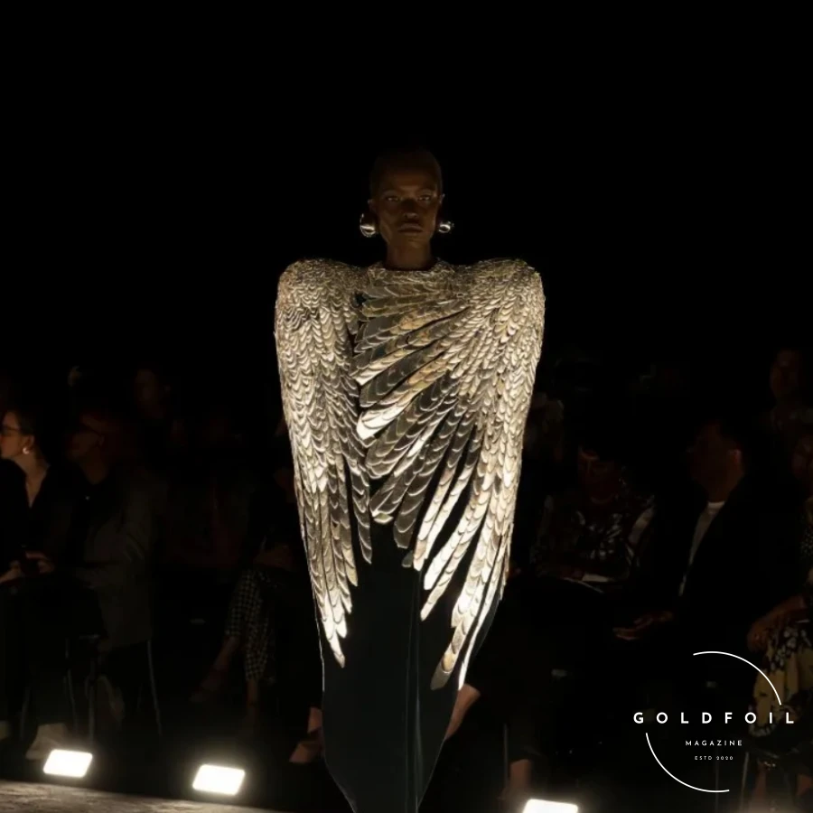 Daniel Roseberry presented what could only be described as one of his best collections since joining Schiaparelli, eschewing gimmicks, props, and influencers like Kylie Jenner with her infamous tiger head from last year. Instead, he focused on craftsmanship through a cinematic quality runway show in a blackout room where fabrics, drapes, and textures spoke through a visual and artistic language. Daniel Roseberry presented what could only be described as one of his best collections since joining Schiaparelli, eschewing gimmicks, props, and influencers like Kylie Jenner with her infamous tiger head from last year. Instead, he focused on craftsmanship through a cinematic quality runway show in a blackout room where fabrics, drapes, and textures spoke through a visual and artistic language.