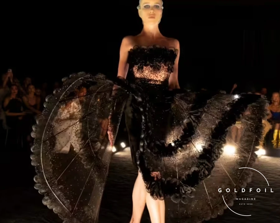 Daniel Roseberry presented what could only be described as one of his best collections since joining Schiaparelli, eschewing gimmicks, props, and influencers like Kylie Jenner with her infamous tiger head from last year. Instead, he focused on craftsmanship through a cinematic quality runway show in a blackout room where fabrics, drapes, and textures spoke through a visual and artistic language. Daniel Roseberry presented what could only be described as one of his best collections since joining Schiaparelli, eschewing gimmicks, props, and influencers like Kylie Jenner with her infamous tiger head from last year. Instead, he focused on craftsmanship through a cinematic quality runway show in a blackout room where fabrics, drapes, and textures spoke through a visual and artistic language.