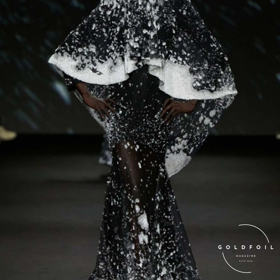 To translate the concept of the passing of time into clothing, Wun envisioned the progression of seasons. The opening look, a majestic black gown with a matching veil embroidered in crystals, depicted “the first falling of snow,” symbolizing winter and its reflective nature. For Wun, accepting time’s limitations fuels creativity; the only way to make time meaningful is to enjoy the moments given, regardless of success or failure. To translate the concept of the passing of time into clothing, Wun envisioned the progression of seasons. The opening look, a majestic black gown with a matching veil embroidered in crystals, depicted “the first falling of snow,” symbolizing winter and its reflective nature. For Wun, accepting time’s limitations fuels creativity; the only way to make time meaningful is to enjoy the moments given, regardless of success or failure.
