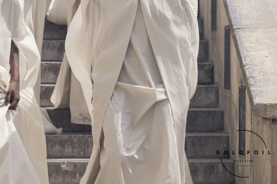 The culmination of Rick Owens’s show was this human tower, with a female model holding a white flag depicting two arms holding hands - one black and one white. What’s interesting about the show is that Rick opened the doors to students and people who would generally not have direct access into the show, and asked them to be a part of this political performance. The culmination of Rick Owens’s show was this human tower, with a female model holding a white flag depicting two arms holding hands - one black and one white. What’s interesting about the show is that Rick opened the doors to students and people who would generally not have direct access into the show, and asked them to be a part of this political performance.