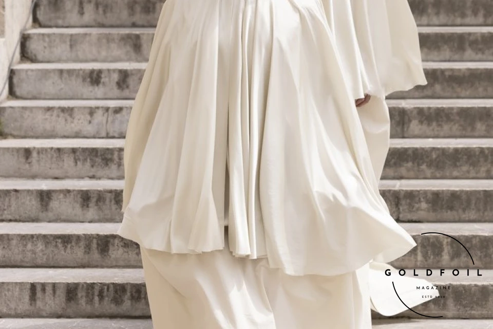 The culmination of Rick Owens’s show was this human tower, with a female model holding a white flag depicting two arms holding hands - one black and one white. What’s interesting about the show is that Rick opened the doors to students and people who would generally not have direct access into the show, and asked them to be a part of this political performance. The culmination of Rick Owens’s show was this human tower, with a female model holding a white flag depicting two arms holding hands - one black and one white. What’s interesting about the show is that Rick opened the doors to students and people who would generally not have direct access into the show, and asked them to be a part of this political performance.