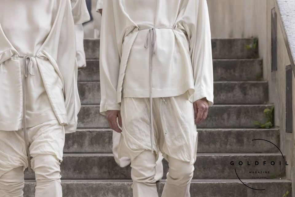 The culmination of Rick Owens’s show was this human tower, with a female model holding a white flag depicting two arms holding hands - one black and one white. What’s interesting about the show is that Rick opened the doors to students and people who would generally not have direct access into the show, and asked them to be a part of this political performance. The culmination of Rick Owens’s show was this human tower, with a female model holding a white flag depicting two arms holding hands - one black and one white. What’s interesting about the show is that Rick opened the doors to students and people who would generally not have direct access into the show, and asked them to be a part of this political performance.