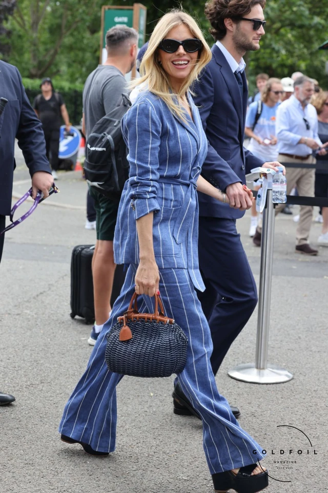 Sienna Miller Walking into the Wimbledon Tennis Championship in 2023 in a stunning striped suit paired with chunky black heels Sienna Miller Walking into the Wimbledon Tennis Championship in 2023 in a stunning striped suit paired with chunky black heels