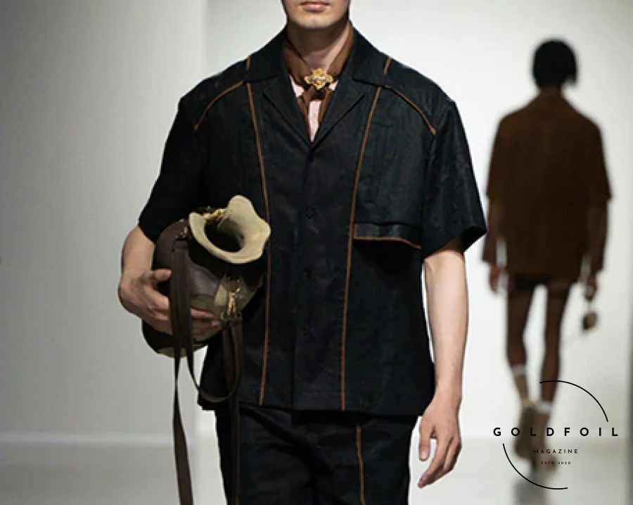 The designer transformed the underground halls of Palais de Tokyo with a futuristic and deconstructed showcase of 35 menswear looks, including standout pieces like colossal shoe covers and a unique UGG collaboration. From office-ready attire to sleek eveningwear, her collection showcased her signature deconstructed techniques and bold vision, solidifying her reputation as a leading designer. The show was inspired by old artefacts and the passing of time, and the colour palette reflected this really well, starting off with a colder blue-tinted white, before transitioning into stained ochra, and darker brown, before closing off with a few denim and black pieces. The designer transformed the underground halls of Palais de Tokyo with a futuristic and deconstructed showcase of 35 menswear looks, including standout pieces like colossal shoe covers and a unique UGG collaboration. From office-ready attire to sleek eveningwear, her collection showcased her signature deconstructed techniques and bold vision, solidifying her reputation as a leading designer. The show was inspired by old artefacts and the passing of time, and the colour palette reflected this really well, starting off with a colder blue-tinted white, before transitioning into stained ochra, and darker brown, before closing off with a few denim and black pieces.