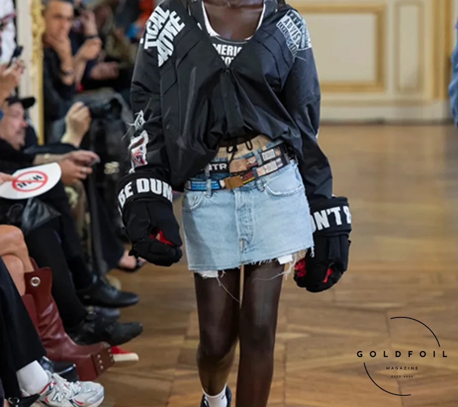 A$AP Rocky's debut at Paris Men’s Fashion Week, under his new brand American Sabotage presented by AWGE, critiqued the political and economic structures of the U.S. Held in Karl Lagerfeld’s former residence, the show attracted chaotic crowds eager to see Rihanna and other celebrities like Maluma and Pusha T. Rocky's collection featured bold designs, including a backless business suit and exaggerated layering inspired by hip-hop's sagging-pants style, with multiple boxer-short bands and stitched-together waistbands creating unique pieces. Rihanna made a dramatic entrance and captured the show from the front row, adding to the spectacle. A$AP Rocky's debut at Paris Men’s Fashion Week, under his new brand American Sabotage presented by AWGE, critiqued the political and economic structures of the U.S. Held in Karl Lagerfeld’s former residence, the show attracted chaotic crowds eager to see Rihanna and other celebrities like Maluma and Pusha T. Rocky's collection featured bold designs, including a backless business suit and exaggerated layering inspired by hip-hop's sagging-pants style, with multiple boxer-short bands and stitched-together waistbands creating unique pieces. Rihanna made a dramatic entrance and captured the show from the front row, adding to the spectacle.