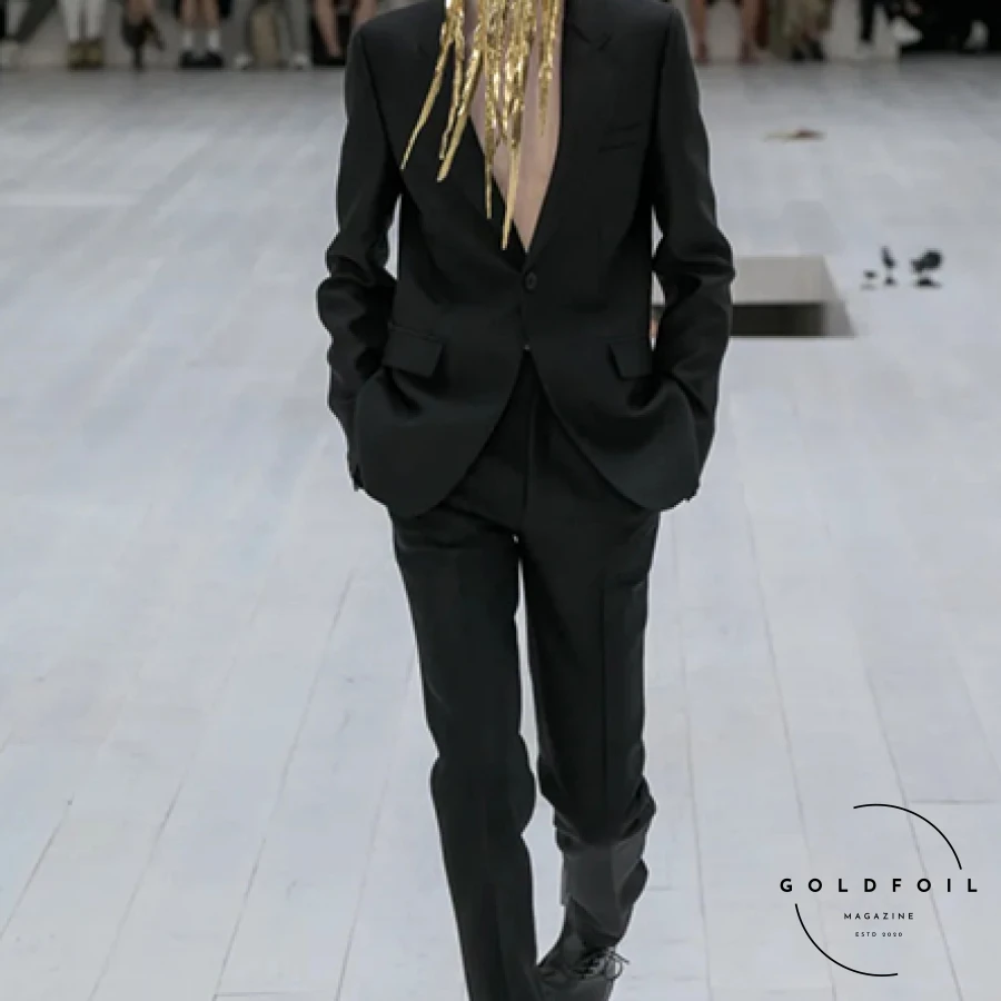 Jonathan Anderson's Loewe Spring men's show exuded restraint and minimalism, set in a serene space with metal mouse sculptures and Susan Sontag's  Jonathan Anderson's Loewe Spring men's show exuded restraint and minimalism, set in a serene space with metal mouse sculptures and Susan Sontag's