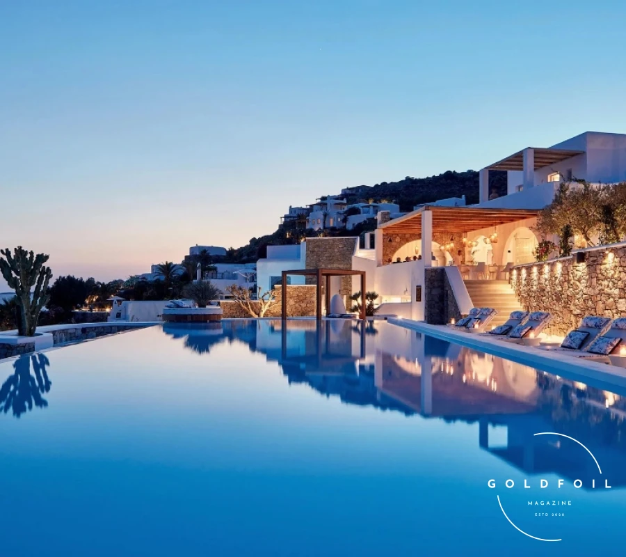 Katikies Mykonos is an enchanting retreat that perfectly encapsulates the island’s allure. Its minimalistic yet luxurious décor, infinity pools, and stunning sea views create an idyllic sanctuary. The hotel’s location in Agios Ioannis allows for a serene atmosphere, while still being close to the island’s bustling hotspots. Guests can enjoy romantic dinners at the Mikrasia Restaurant, which serves delectable Greek and Anatolian cuisine, or unwind with a cocktail at the Seltz Champagne Bar & Restaurant. Katikies Mykonos is an enchanting retreat that perfectly encapsulates the island’s allure. Its minimalistic yet luxurious décor, infinity pools, and stunning sea views create an idyllic sanctuary. The hotel’s location in Agios Ioannis allows for a serene atmosphere, while still being close to the island’s bustling hotspots. Guests can enjoy romantic dinners at the Mikrasia Restaurant, which serves delectable Greek and Anatolian cuisine, or unwind with a cocktail at the Seltz Champagne Bar & Restaurant.