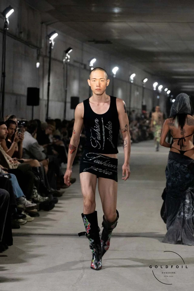 Namilia’s Spring/Summer 2025 runway show at Berlin Fashion Week was a visionary spectacle that fused futuristic design with potent social commentary. Designers Nan Li and Emilia Pfohl showcased a collection featuring high-tech fabrics, bold silhouettes, and symbolic embellishments depicting feminist icons. The use of biodegradable plastics, LED-embedded fabrics, and 3D-printed accessories highlighted the brand's commitment to sustainability, while oversized visors, holographic boots, and avant-garde jewellery added to the futuristic aesthetic. Multimedia presentations on gender equality, body positivity, and climate change underscored the show’s activist message, earning critical acclaim and reinforcing Namilia’s reputation for pushing fashion’s boundaries and inspiring change. Namilia’s Spring/Summer 2025 runway show at Berlin Fashion Week was a visionary spectacle that fused futuristic design with potent social commentary. Designers Nan Li and Emilia Pfohl showcased a collection featuring high-tech fabrics, bold silhouettes, and symbolic embellishments depicting feminist icons. The use of biodegradable plastics, LED-embedded fabrics, and 3D-printed accessories highlighted the brand's commitment to sustainability, while oversized visors, holographic boots, and avant-garde jewellery added to the futuristic aesthetic. Multimedia presentations on gender equality, body positivity, and climate change underscored the show’s activist message, earning critical acclaim and reinforcing Namilia’s reputation for pushing fashion’s boundaries and inspiring change.