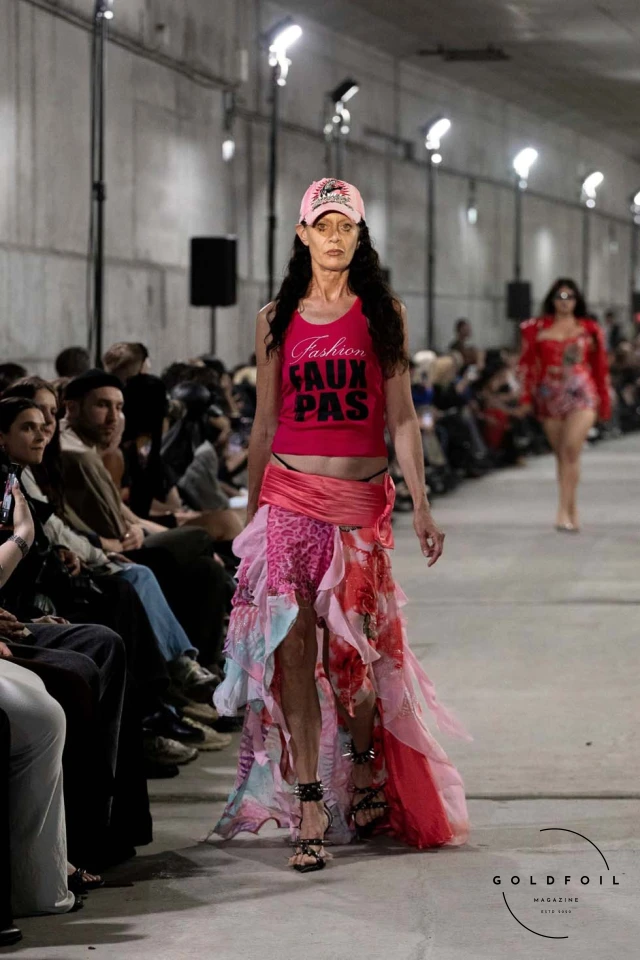 Namilia’s Spring/Summer 2025 runway show at Berlin Fashion Week was a visionary spectacle that fused futuristic design with potent social commentary. Designers Nan Li and Emilia Pfohl showcased a collection featuring high-tech fabrics, bold silhouettes, and symbolic embellishments depicting feminist icons. The use of biodegradable plastics, LED-embedded fabrics, and 3D-printed accessories highlighted the brand's commitment to sustainability, while oversized visors, holographic boots, and avant-garde jewellery added to the futuristic aesthetic. Multimedia presentations on gender equality, body positivity, and climate change underscored the show’s activist message, earning critical acclaim and reinforcing Namilia’s reputation for pushing fashion’s boundaries and inspiring change. Namilia’s Spring/Summer 2025 runway show at Berlin Fashion Week was a visionary spectacle that fused futuristic design with potent social commentary. Designers Nan Li and Emilia Pfohl showcased a collection featuring high-tech fabrics, bold silhouettes, and symbolic embellishments depicting feminist icons. The use of biodegradable plastics, LED-embedded fabrics, and 3D-printed accessories highlighted the brand's commitment to sustainability, while oversized visors, holographic boots, and avant-garde jewellery added to the futuristic aesthetic. Multimedia presentations on gender equality, body positivity, and climate change underscored the show’s activist message, earning critical acclaim and reinforcing Namilia’s reputation for pushing fashion’s boundaries and inspiring change.