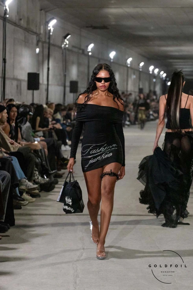 Namilia’s Spring/Summer 2025 runway show at Berlin Fashion Week was a visionary spectacle that fused futuristic design with potent social commentary. Designers Nan Li and Emilia Pfohl showcased a collection featuring high-tech fabrics, bold silhouettes, and symbolic embellishments depicting feminist icons. The use of biodegradable plastics, LED-embedded fabrics, and 3D-printed accessories highlighted the brand's commitment to sustainability, while oversized visors, holographic boots, and avant-garde jewellery added to the futuristic aesthetic. Multimedia presentations on gender equality, body positivity, and climate change underscored the show’s activist message, earning critical acclaim and reinforcing Namilia’s reputation for pushing fashion’s boundaries and inspiring change. Namilia’s Spring/Summer 2025 runway show at Berlin Fashion Week was a visionary spectacle that fused futuristic design with potent social commentary. Designers Nan Li and Emilia Pfohl showcased a collection featuring high-tech fabrics, bold silhouettes, and symbolic embellishments depicting feminist icons. The use of biodegradable plastics, LED-embedded fabrics, and 3D-printed accessories highlighted the brand's commitment to sustainability, while oversized visors, holographic boots, and avant-garde jewellery added to the futuristic aesthetic. Multimedia presentations on gender equality, body positivity, and climate change underscored the show’s activist message, earning critical acclaim and reinforcing Namilia’s reputation for pushing fashion’s boundaries and inspiring change.