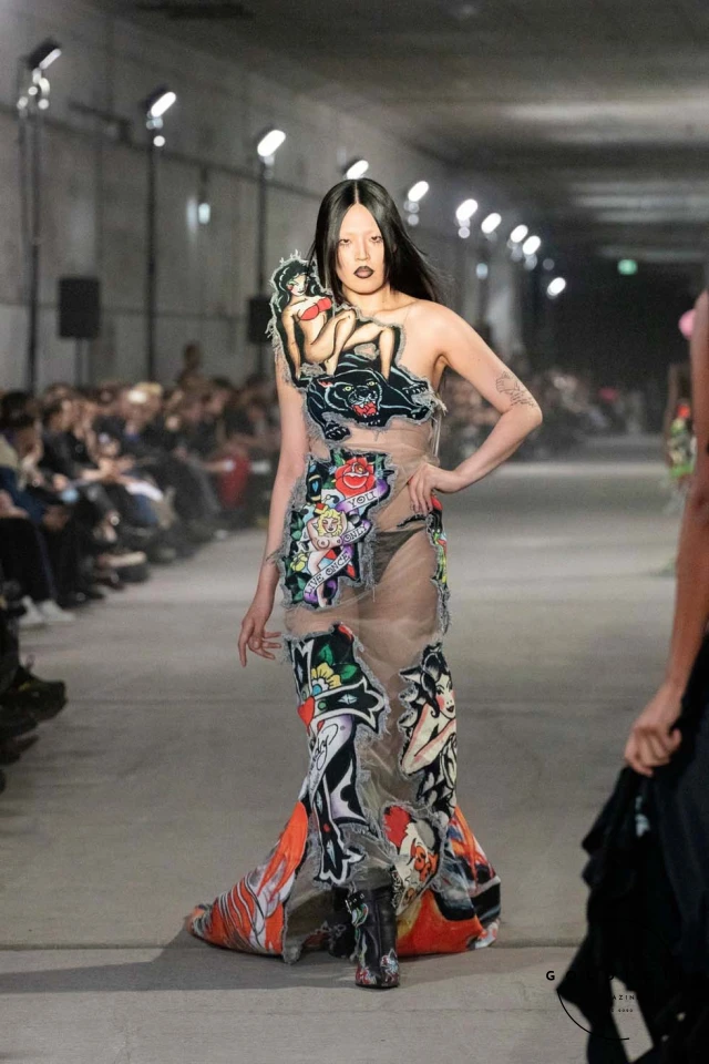 Namilia’s Spring/Summer 2025 runway show at Berlin Fashion Week was a visionary spectacle that fused futuristic design with potent social commentary. Designers Nan Li and Emilia Pfohl showcased a collection featuring high-tech fabrics, bold silhouettes, and symbolic embellishments depicting feminist icons. The use of biodegradable plastics, LED-embedded fabrics, and 3D-printed accessories highlighted the brand's commitment to sustainability, while oversized visors, holographic boots, and avant-garde jewellery added to the futuristic aesthetic. Multimedia presentations on gender equality, body positivity, and climate change underscored the show’s activist message, earning critical acclaim and reinforcing Namilia’s reputation for pushing fashion’s boundaries and inspiring change. Namilia’s Spring/Summer 2025 runway show at Berlin Fashion Week was a visionary spectacle that fused futuristic design with potent social commentary. Designers Nan Li and Emilia Pfohl showcased a collection featuring high-tech fabrics, bold silhouettes, and symbolic embellishments depicting feminist icons. The use of biodegradable plastics, LED-embedded fabrics, and 3D-printed accessories highlighted the brand's commitment to sustainability, while oversized visors, holographic boots, and avant-garde jewellery added to the futuristic aesthetic. Multimedia presentations on gender equality, body positivity, and climate change underscored the show’s activist message, earning critical acclaim and reinforcing Namilia’s reputation for pushing fashion’s boundaries and inspiring change.