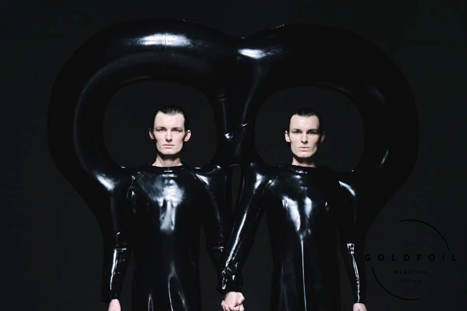 Harri's Spring/Summer 2025 collection at London Fashion Week showcased his bold use of latex and innovative, sculptural designs, solidifying his status as a leading avant-garde fashion designer. Known for his futuristic and apocalyptic aesthetic, Harri presented oversized, balloon-like silhouettes, skin-tight latex pieces, and dramatic, inflated trousers, pushing the boundaries of traditional fashion. The collection, which marked Harri’s debut in womenswear, drew inspiration from Renaissance art, blending powerful, regal silhouettes with modern latex fabrics. This SS25 runway show highlighted Harri's ability to combine artistry, craftsmanship, and boundary-pushing designs, making it one of the most talked-about events at London Fashion Week. Harri's Spring/Summer 2025 collection at London Fashion Week showcased his bold use of latex and innovative, sculptural designs, solidifying his status as a leading avant-garde fashion designer. Known for his futuristic and apocalyptic aesthetic, Harri presented oversized, balloon-like silhouettes, skin-tight latex pieces, and dramatic, inflated trousers, pushing the boundaries of traditional fashion. The collection, which marked Harri’s debut in womenswear, drew inspiration from Renaissance art, blending powerful, regal silhouettes with modern latex fabrics. This SS25 runway show highlighted Harri's ability to combine artistry, craftsmanship, and boundary-pushing designs, making it one of the most talked-about events at London Fashion Week.