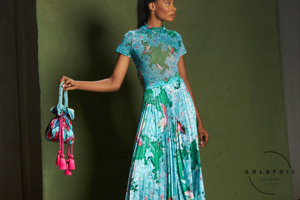 Banke Kuku showcases a colourful collection, in this photo we can see a long dress with a pleated bottom half in a stunning vibrant marine blue