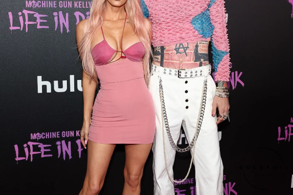 Machine Gun kelly and Megan Fox wearing an all Barbie inspired look to the MGK Hulu premiere