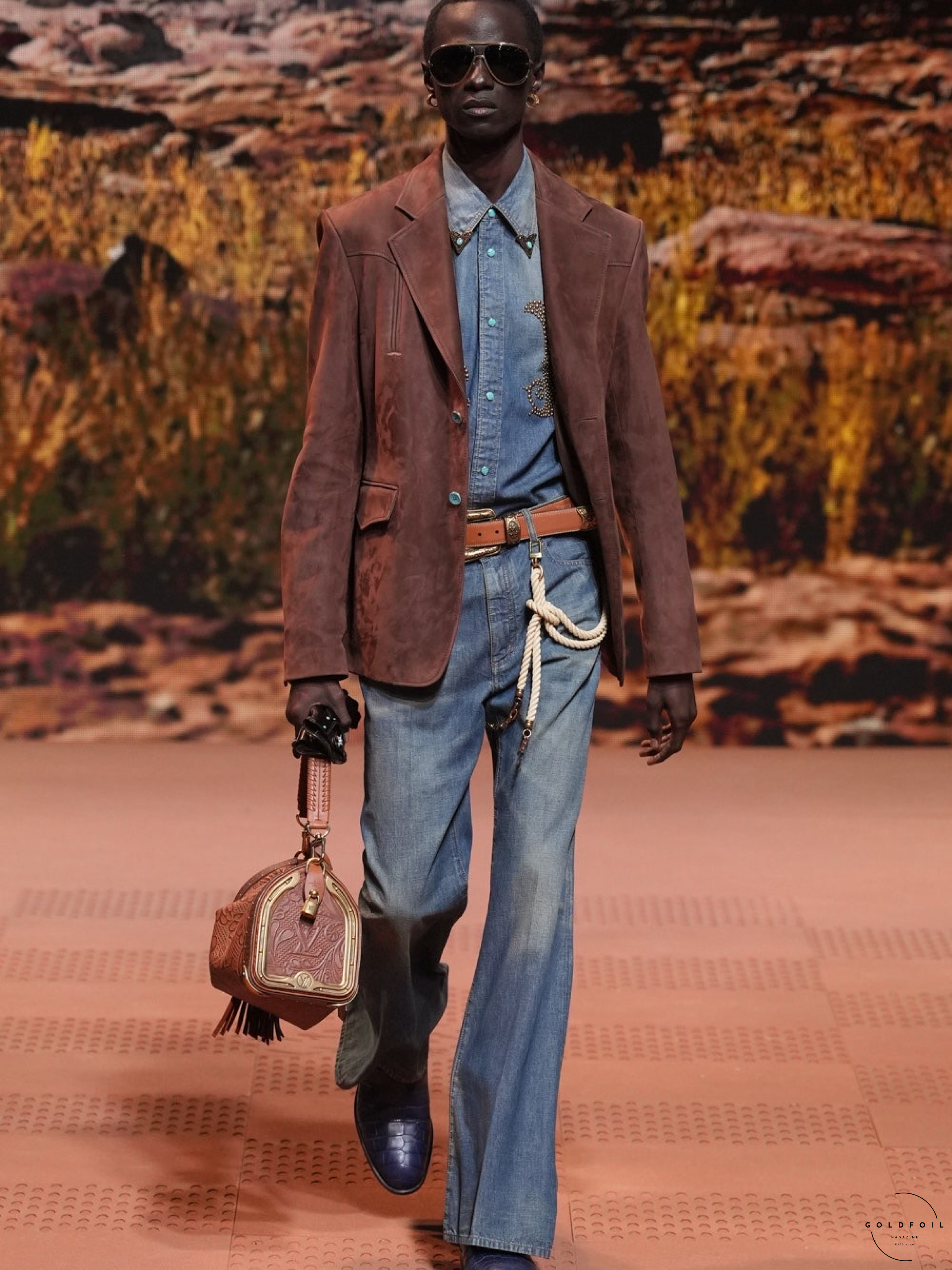 Cowboy inspired outfit on the runway show of Louis Vuitton Autumn Winter 2024 in Paris, GoldFoil Magazine is a London based fashion magazine